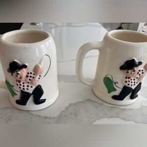Vintage Pfaltzgraff "Muggsy" mugs depicting the "Rodney Reel" fishing design